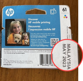 A toner cartridge box past its printed date, still sealed